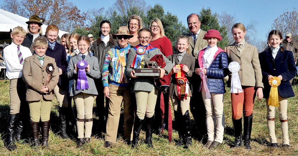 First Field 12 & Under: Emma Keahon, local Reserve Champion from Old Dominion Hounds, next to Champion Maggie Buchanan, Mr. Stewart’s Cheshire Foxhounds, with ribbon winners and VIPs. Photos by Lauren R. Giannini