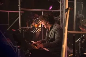  Tom Sweitzer rocking out on the keyboard with Cedric Dimapilis on guitar in A Will to Survive 