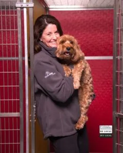 Managing director of The ARK at JFK, Elizabeth Schuette, with her dog Tucker in the Pet Oasis.