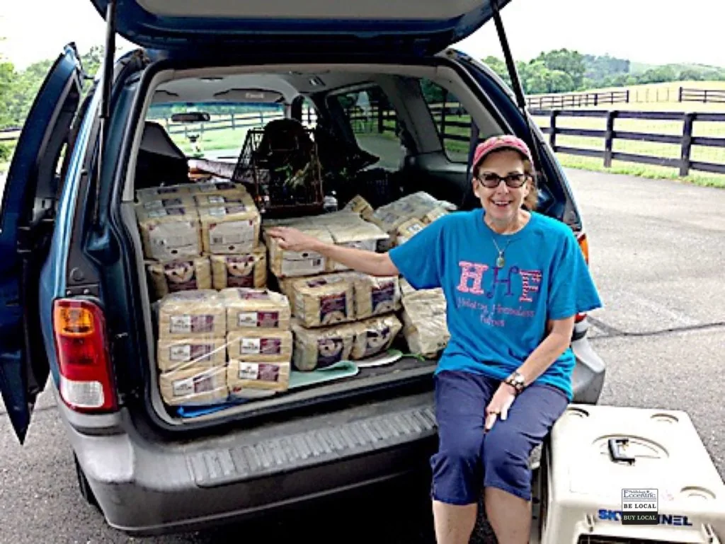 Val Garcia of ‘Helping Homeless Felines’ picking up donated food at Ursula’s home.